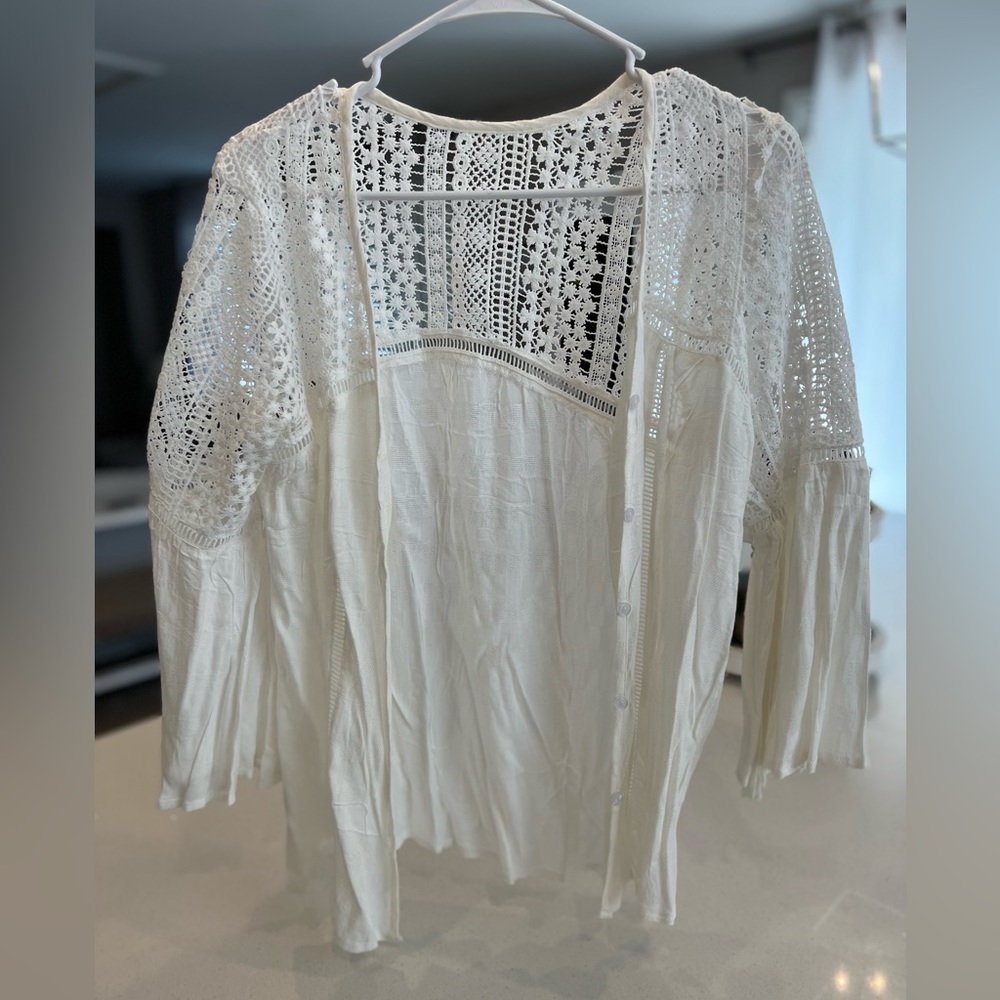 White see through cover up. Never been worn. Size small.